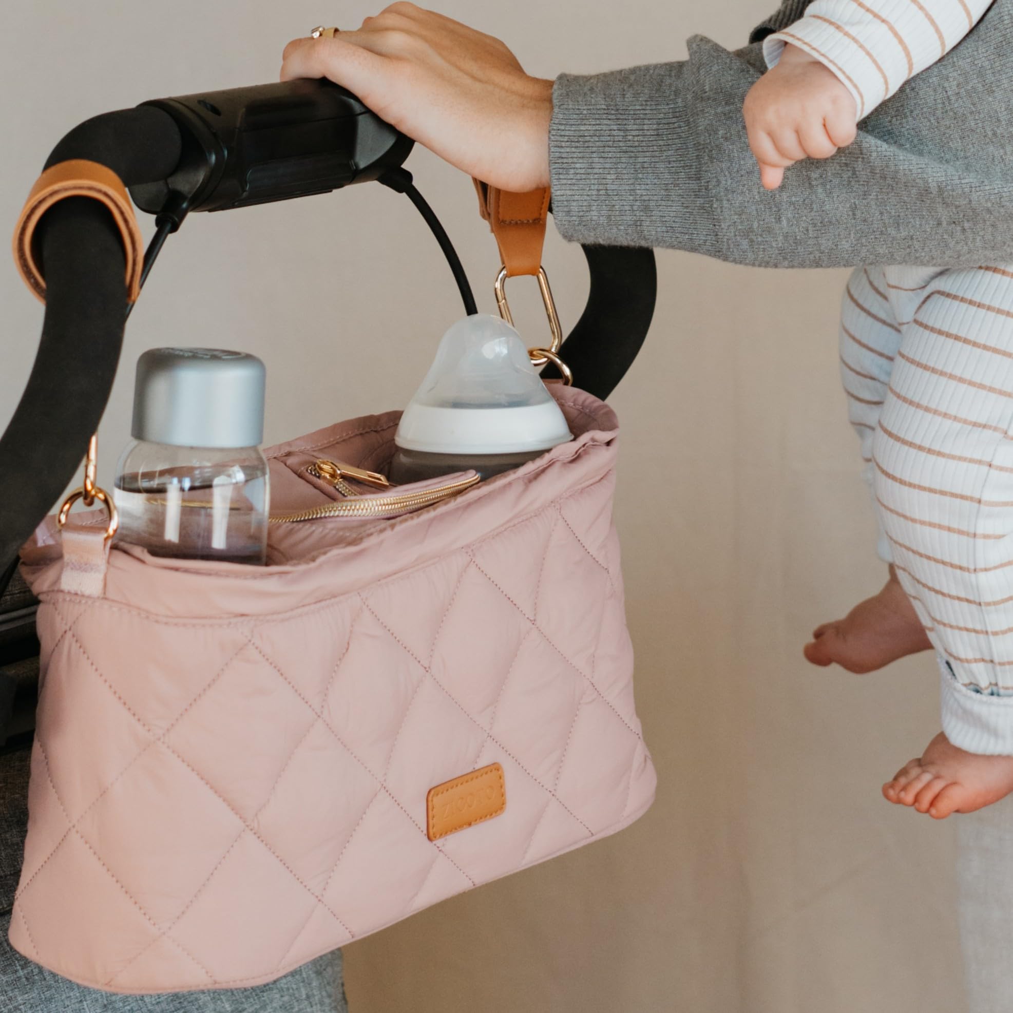 Pink ZICOTO stroller caddy organizer with two insulated cup holders attached to a stroller